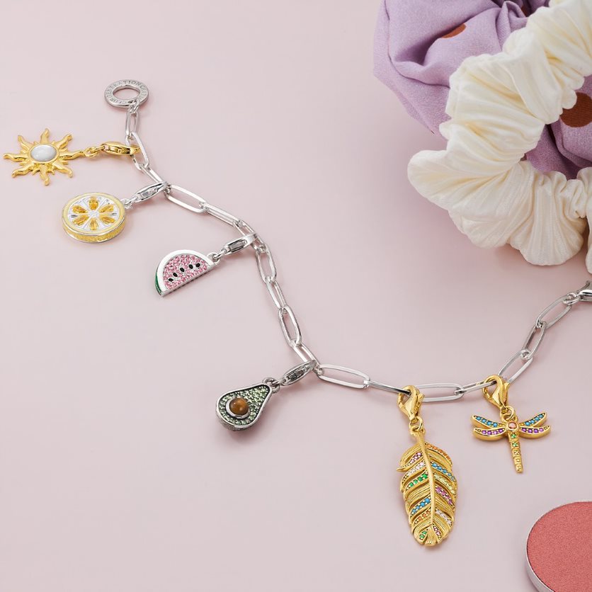 Rose gold charm bracelets with lovely trinkets -